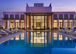 Conrad Rabat Arzana view across pool to facade