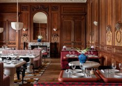 wood panelled dining room in english manor house with restaurant setting