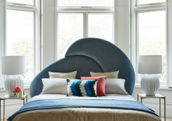 sofa.com's teal Harmony bedframe infront of bay window