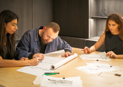 3 Conran & Partners designers working on sketches of the new ABI Interiors Clerkenwell showroom