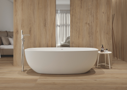 White bath tub set in wood panelled bathroom