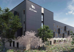 Exterior of Voco Zeal hotel in exeter. Charcoal coloured outer with image taken against dusk sky