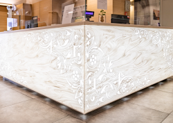 Corian reception desk, carved and backlit