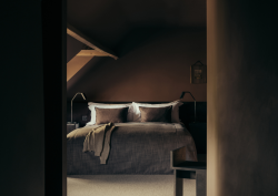 Dark brown painted bedroom with curved ceiling
