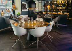 Tap Del Bar project, featuring the BoConcept Madrid dining table with gold finish top