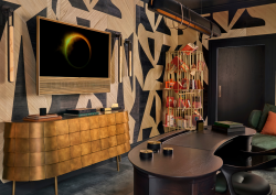 Phillip Jeffries Study by Staffan Tollgard, black and white geometric walls lined with wood veneer