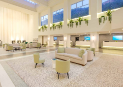Corian curtain wall in white lobby space