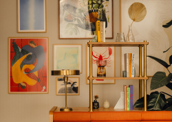Gallery wall with brass pipe shelving in Communal space at Branch members club, by Holloway Li
