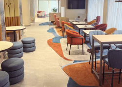 Luxury Carpet Studio orange and blue rugs in lobby area of marriott hotel