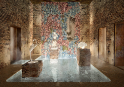 Mosaic wall and internal courtyard with water feature and white animal statues