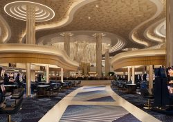 blue carpet leading into Fontainbleu Las Vegas casino floor below curved ceiling