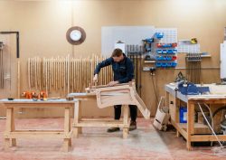 George Smith workshop with wooden chair frame being made