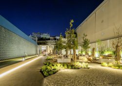 outdoor lighting, planting and seating between the two buildings of Hotel DUO Boavista