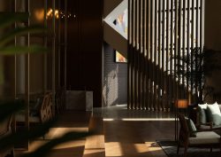 filtered sunlight and shadows through slatted wooden screen in Cacao BarPark Hyatt Kuala Lumpur with interiors by GA Group
