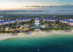 Aerial shot of the blue waters and white sand beaches in front of the Salterra beachside resort