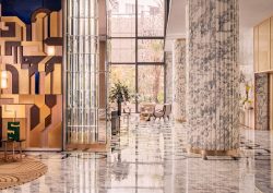 marble columns and art deco mural in lobby of Royal Mansour Casablanca