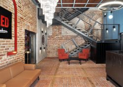 brick walls and metal stairs loft style decor at Radisson RED Gdansk