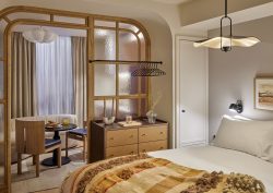 guestroom with curved wood dividing frame in Locke De Santa Joana Lisbon