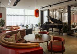 Piano and seating in Lowry Hotel Bar with wooden flooring