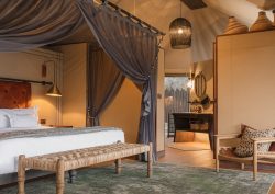 guestroom and bathroom at Madwaleni Lodge designed by Luxury Frontiers