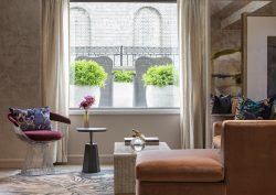 window vignette with couch and chair in Meadow Terrace Suite in JW Marriott
