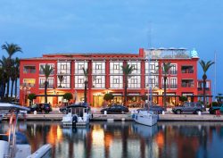 hotel facade with boats and harbour lights at MiM Sotogrande
