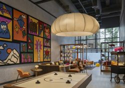 oversized light and colourful paintings in the play zone of Moxy Kathmandu