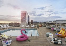 pink inflatable flamingo at pool around Moxy Barcelona