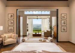 view from bed, through doors onto terrace at Uga Ghiri, in Sri Lanka’s central highlands region