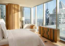 view from bed onto Philadelphia city skyline in design by 1508 for The Sky Garden, Four Seasons Philadelphia