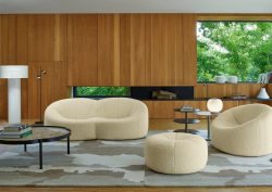 lounge with wooden panelled walls and mid century design furniture in cream from Ligne Roset
