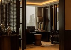 Rosewood doha seating space in clubhouse lounge with view across Doha