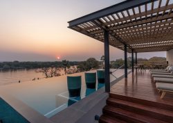 sunset view over swimming pool at Radisson Blu Mosi-oa-Tunya, Livingstone Resort