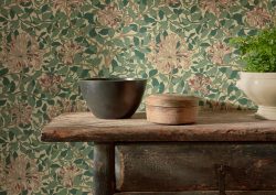 wooden shelf with bowls in front of morris & co wallpaper
