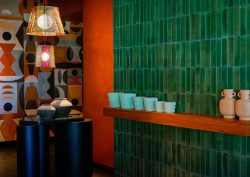 green tiled wall - orange pillar - painted mural in Salted Egg Darwin