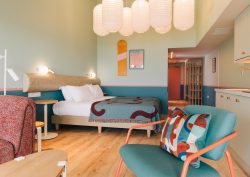 turquoise and brown mid century inspired aparthotel guestroom SeaSpace