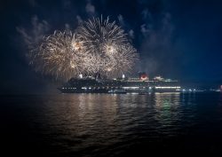 Cunard's Queen Anne ship with fireworks in the background