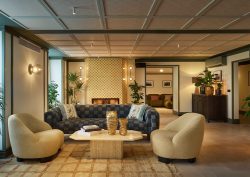 tub chairs and sofa around coffee table in The Cover Vienna