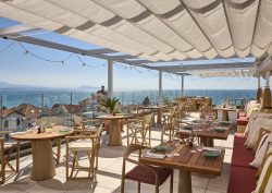 roof terrace with sea view under white shade cloth at Talaia Hotel Spa Biarritz