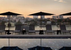 pool and parasols at dusk at The StandardX, Bangkok Phra Arthit