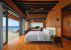 bed looking out to sea in The Westin Maldives Miriandhoo Resort