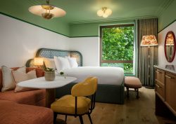 green ceiling and white wall and green headboard in the July with hypnos mattress