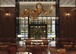 entrance and lobby space in Park Hyatt London River Thames with suspended gold sculpture