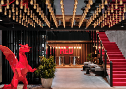 feature lighting on ceiling and red dragon at entrance to Radisson Red Krakow