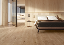 minimalist bedroom set with surfaces in LOG wood effect tiles from Atlas Concorde