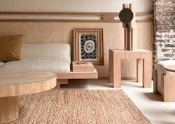 round wooden table, low wooden seating and natural fibre flooring in Élysée Montmartre Hotel