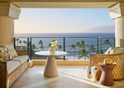 seats on verandah overlooking the ocean at Four Seasons Resort Maui at Wailea debuts the Club Floor,