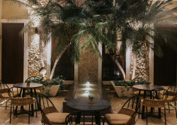 internal courtyard at Kahal with palm trees and fountain