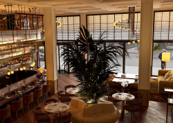 view front 2nd level looking down on bar and lobby with street views in Only YOU Hotel New York