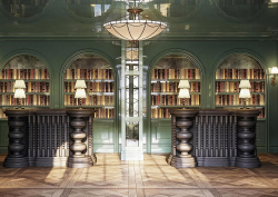 lobby with bookshelves behind reception desks and centred feature light in Fairmont Cheshire, The Mere